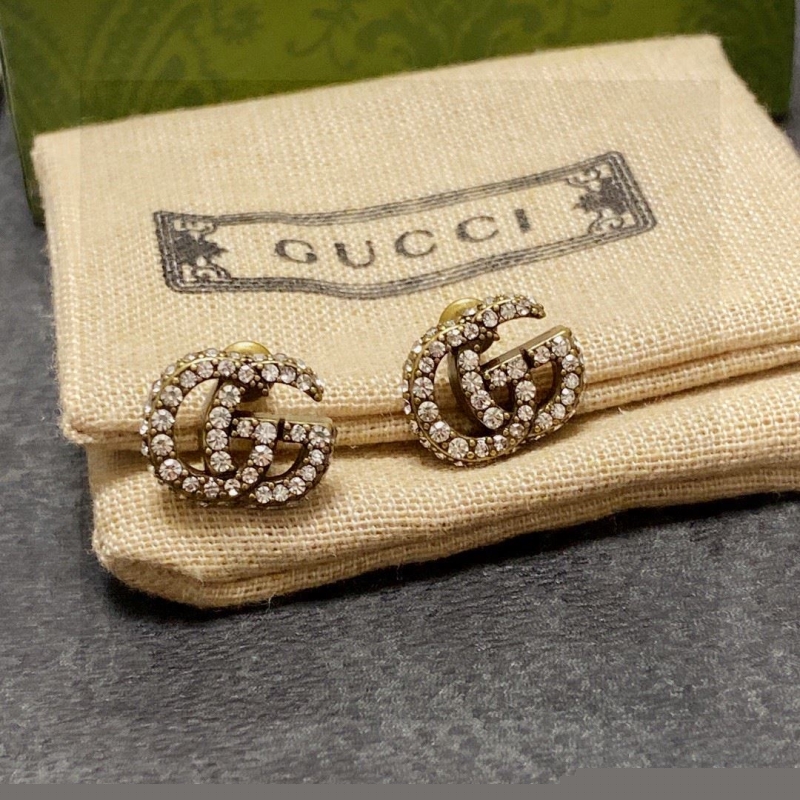 G*u*i earrings